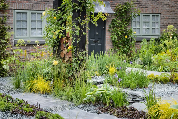 Front garden planted with irises and hostas Front garden planted with irises and hostas