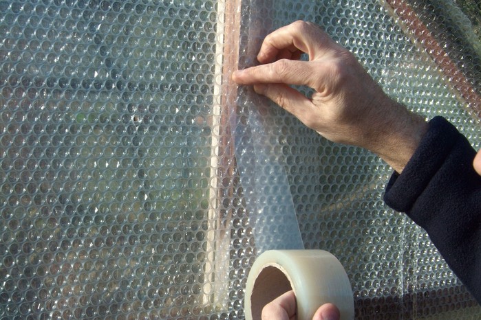Joining sheets of bubble-wrap with clear, weatherproof tape Joining sheets of bubble-wrap with clear, weatherproof tape